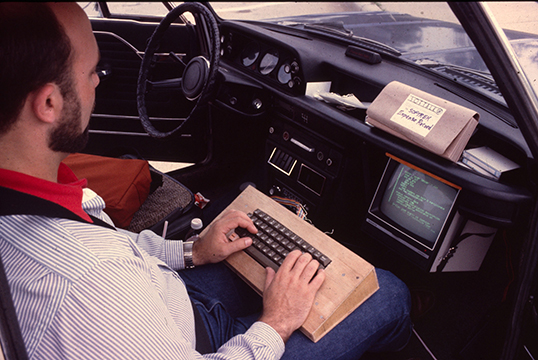 Softrek - Jim Salmons using Apple computer in car 1982